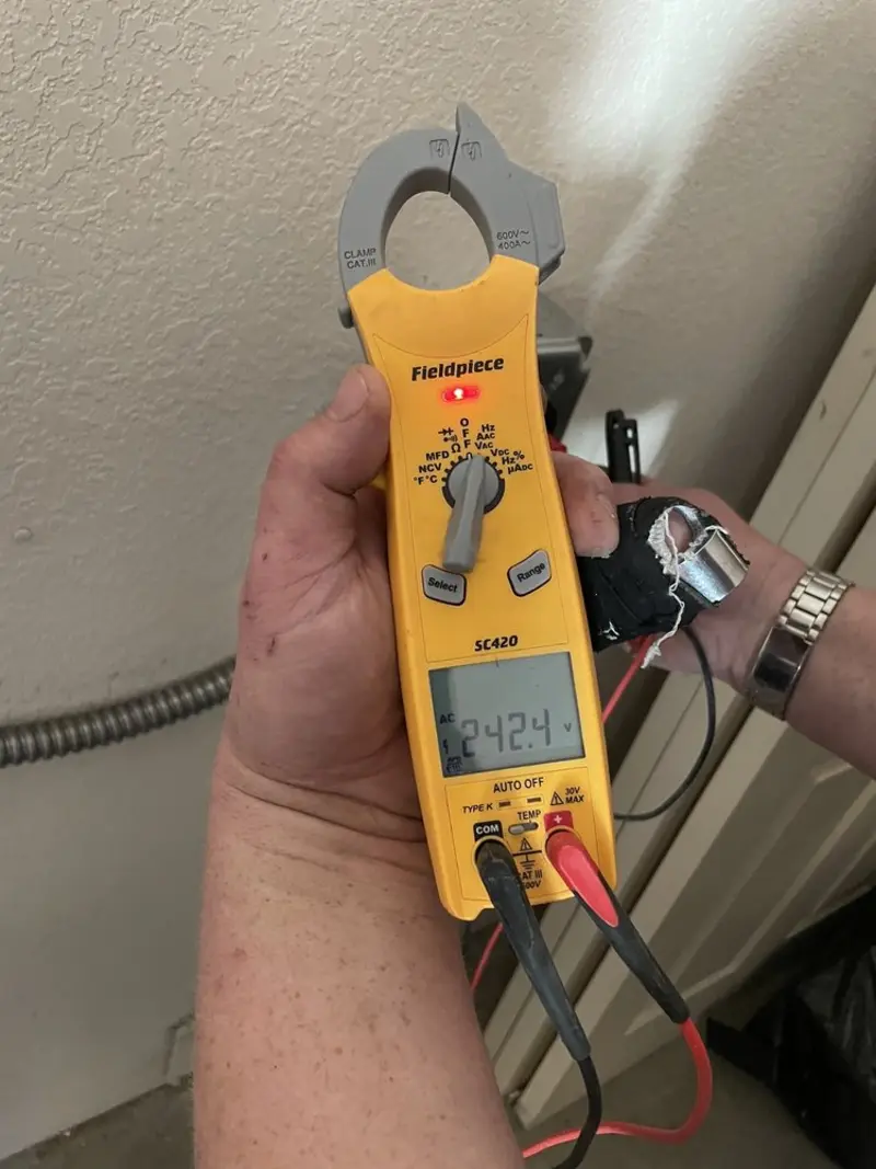 Voltage testing with clamp meter during Outlet Installation in Wareham